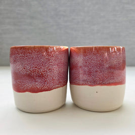 set of two handmade ceramic lungo cups with speckled berry pink glaze and white base