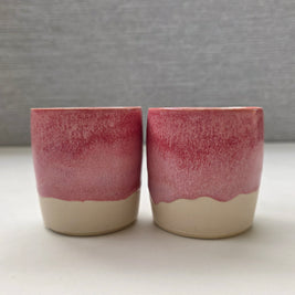 set of two handmade ceramic lungo cups with a rose glaze and warm white base