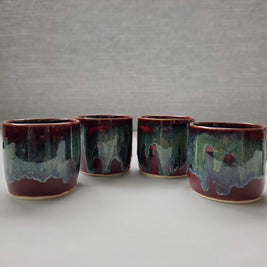 handmade ceramic lungo cups with deep maroon glaze and teal wash detail