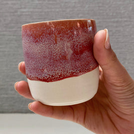 handmade ceramic lungo cup with speckled berry pink glaze and white base