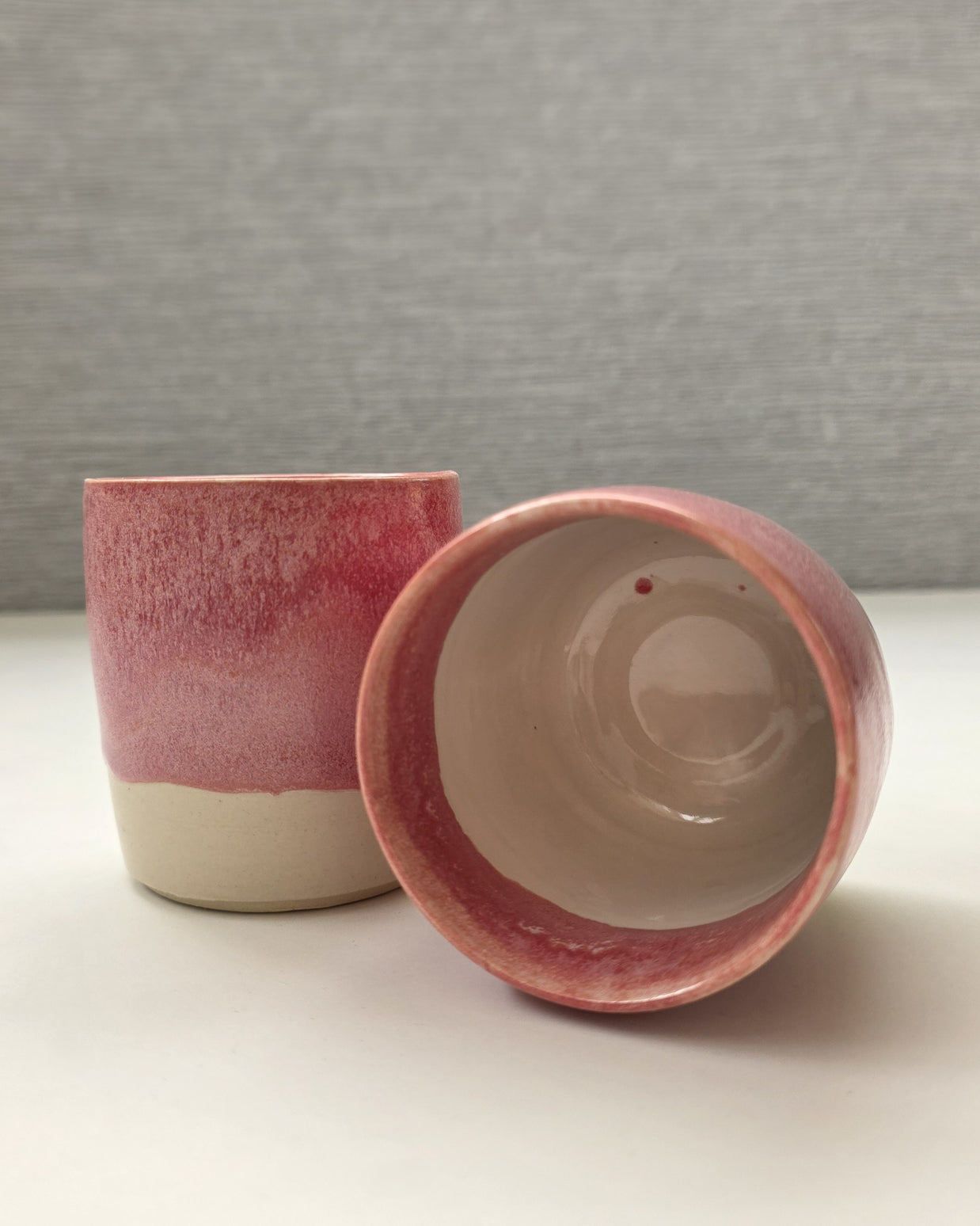 interior of handmade ceramic lungo cup with white glaze and slight pink glaze markings