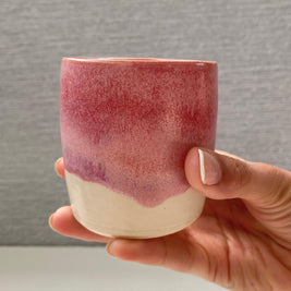 handmade ceramic lungo cup with a rose glaze and warm white base