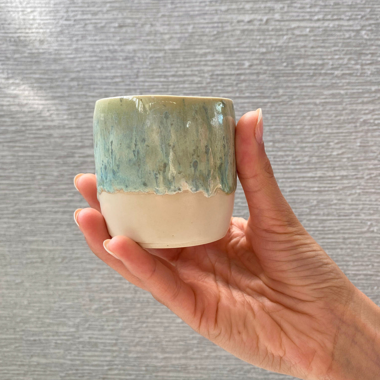 handmade ceramic cup with seafoam green and blue glaze over a warm white-beige base (small size)